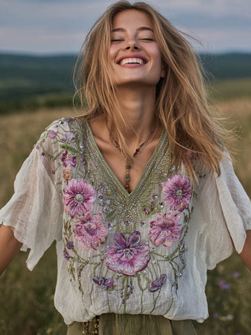 Blusa de mujer con cuello en V y bordado floral desgastado 